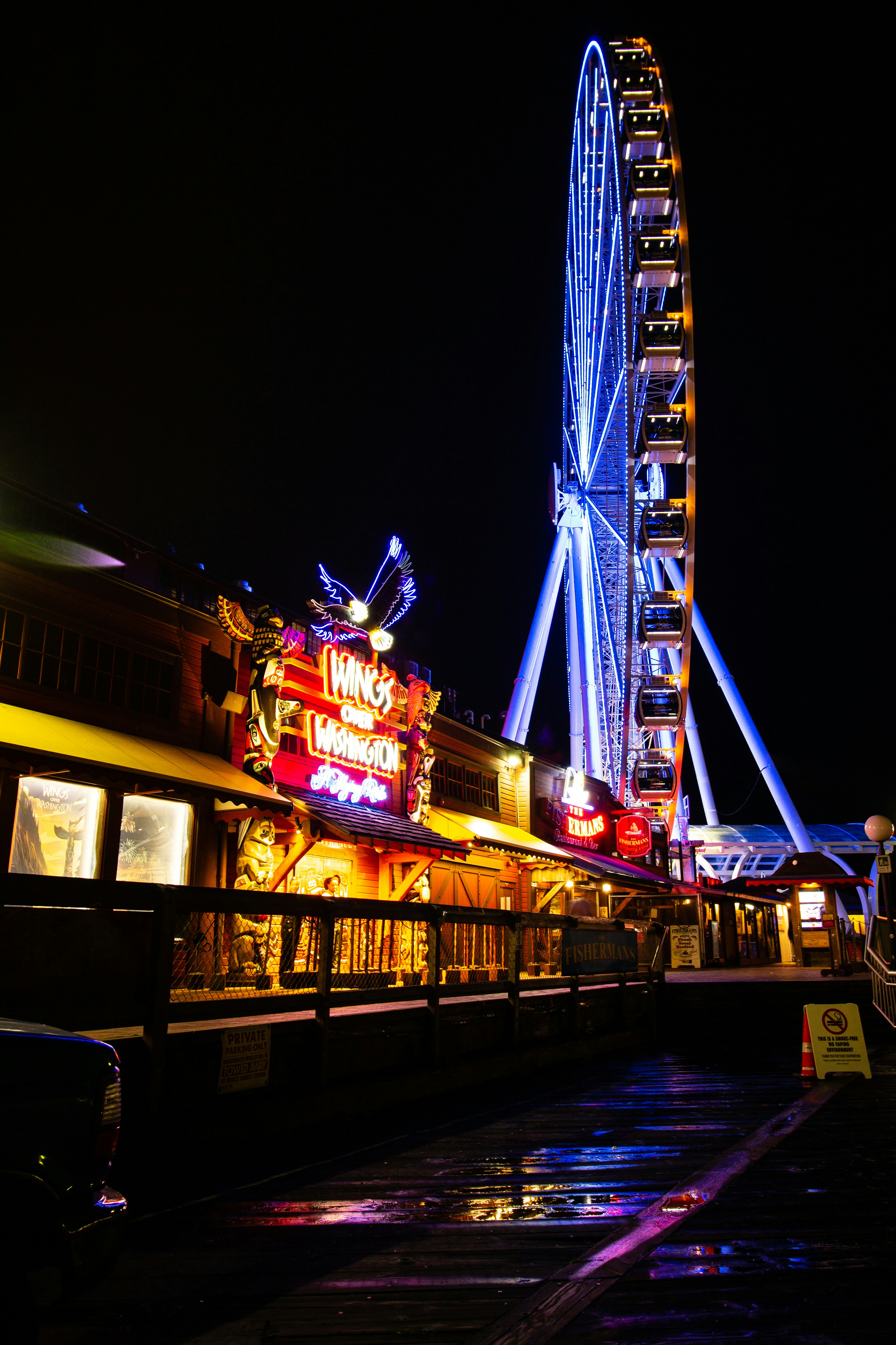 Ferris wheel at the amusement park during night